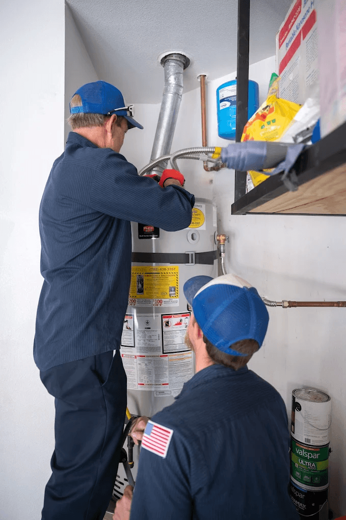 Plumber in Rainbow Park, Las Vegas | Active Plumbing. Two Active Plumbing plumbers performing a residential water heater installation and inspection.
