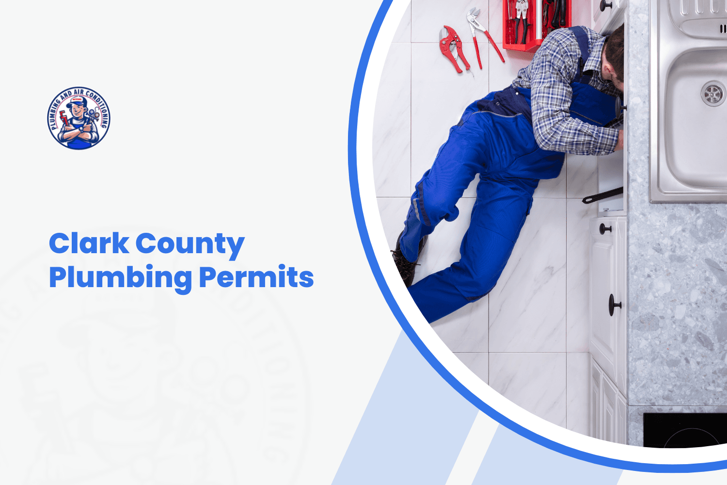 Plumber in blue overalls working under kitchen sink for Clark County permit work